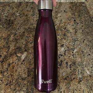 Swell 17 oz. slim silhouette insulated sparkle purple pattern beverage bottle.